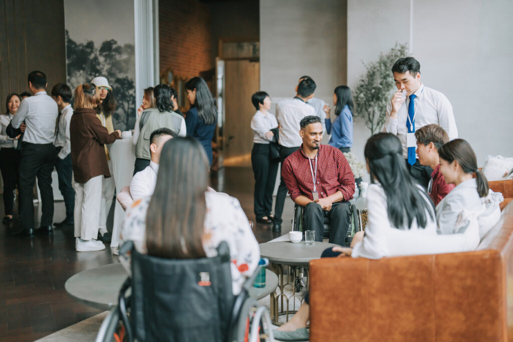 Asian Diversity and Inclusion seminar participants casual chat after successful conference event at lounge